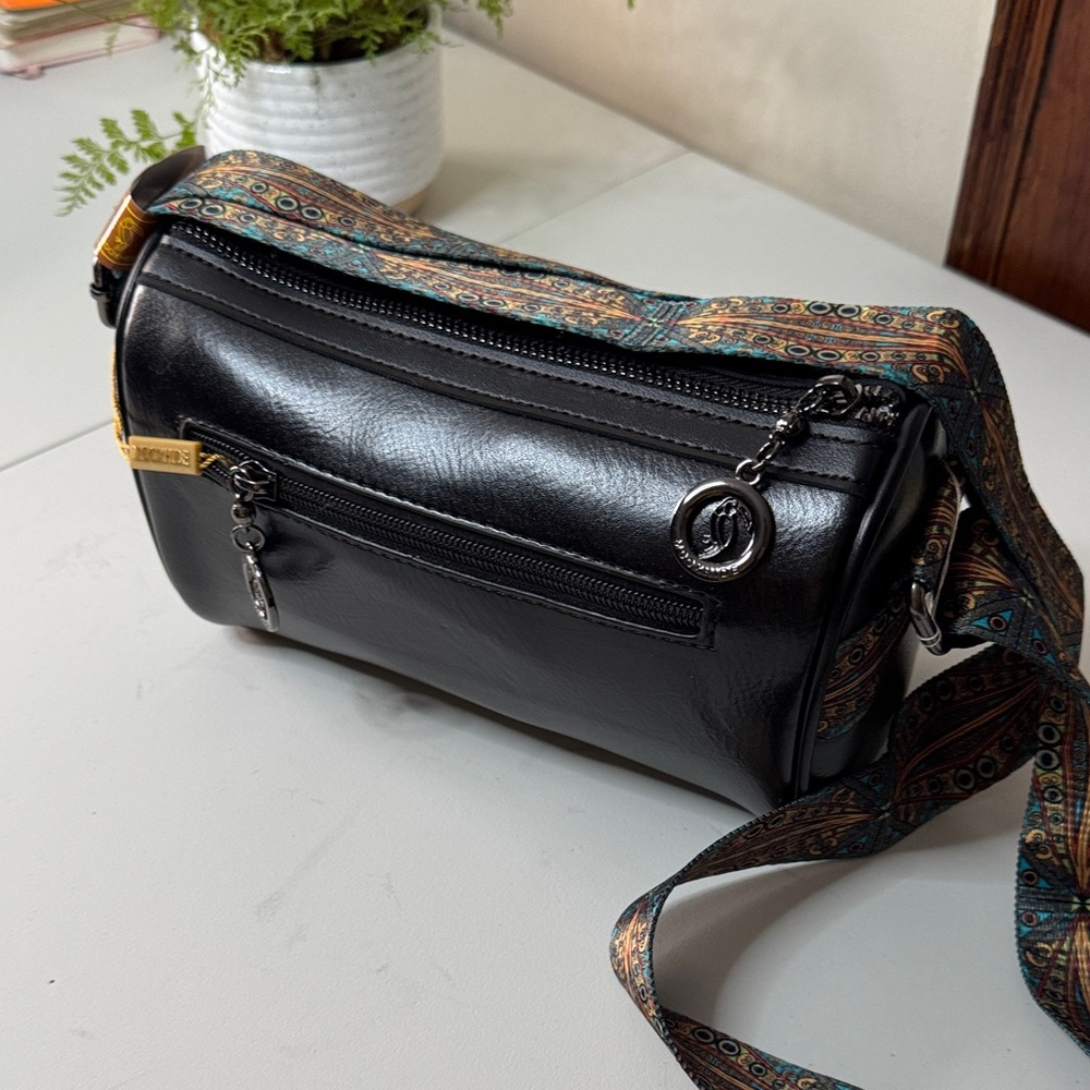 Chic Black Crossbody Bag with Patterned Strap